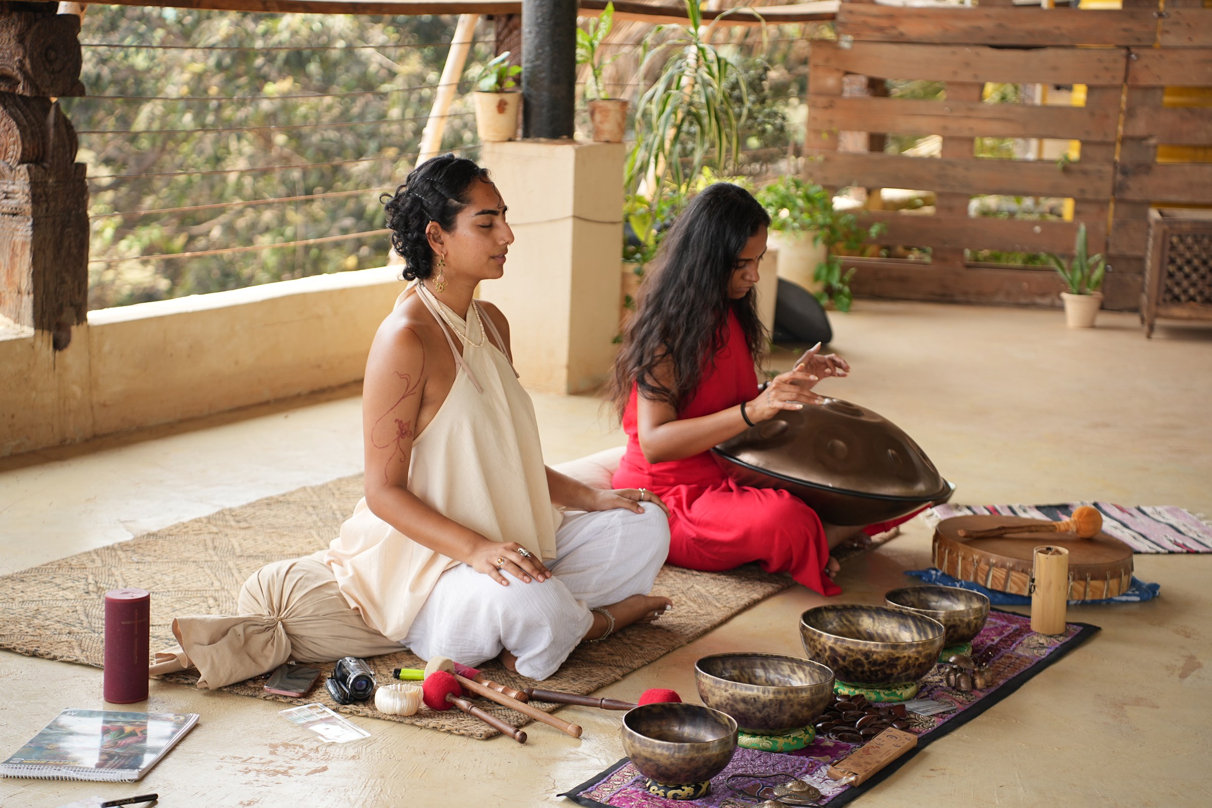 Retreat facilitator leading a sound healing session